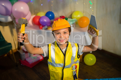 Boy pretending as a worker during birthday party