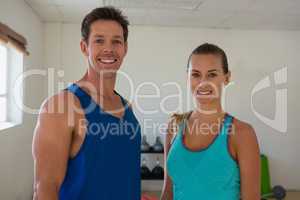 Portrait of smiling friends in fitness club