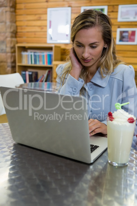 Young woman using laptop