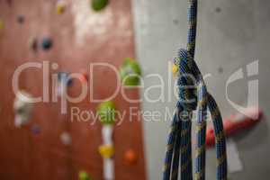 Close up of rope against climbing wall at gym