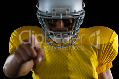 American football player pointing with one hand