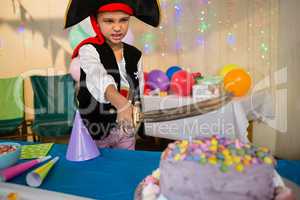 Boy pretending to be as pirate during birthday party