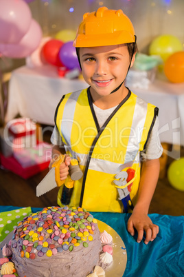 Boy pretending as a worker during birthday party