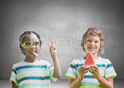 Boys with watermelon and sunglasses in front of grey background