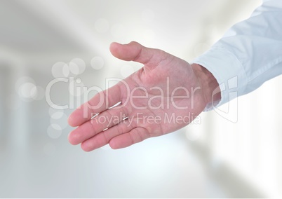 Business man stretching hand against white background Business man stretching hand against white background