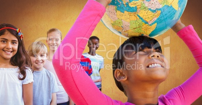 Multinational and multicultural children holding world globe with gold background