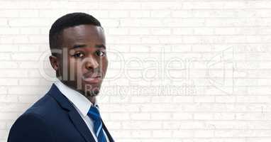 Business man standing against white wall background