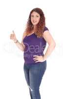 Curvy woman standing in profile with thump up