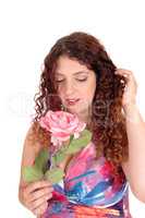 Beautiful woman holding a pink rose