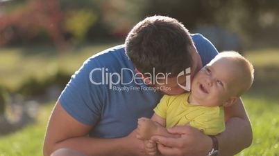 Loving father and toddler boy having fun outdoors