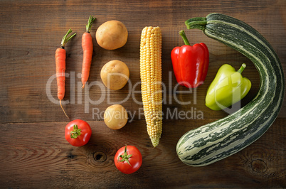 Healthy food background .Different vegetables on old wooden tabl