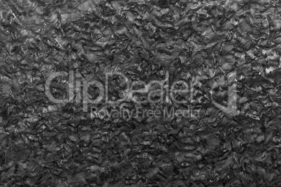 Black granite stone surface background.