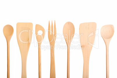 Set of new wooden kitchen utensils spoons isolated on white.