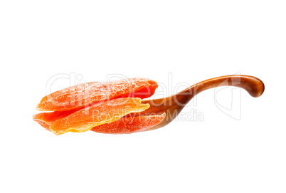 Dry mango in the wooden spoon, isolated on white background.