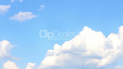 White Fluffy Clouds In The Blue Sky. Timelapse Video