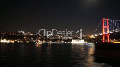 Sailing under Istanbul's bridge at night