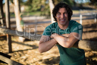 Man smiling at camera in the ranch