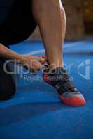 Woman wearing shoes in gym