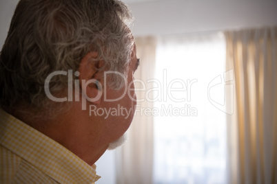 Close up of thoughtful senior man in nursing home