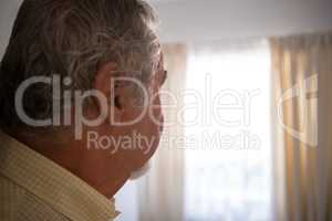 Close up of thoughtful senior man in nursing home