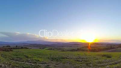Sunset over the Tuscany Fields. Time Lapse