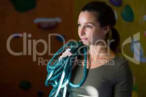 Woman with rope in fitness studio