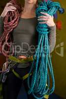 Woman with rope in fitness studio