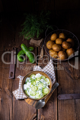 fresh cucumber salad with yogurt and young potatoes