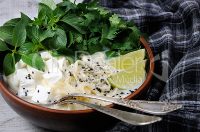 Rice soup with noodles and tofu