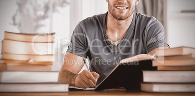 Portrait of smiling student preparing for exam