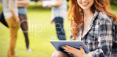 Pretty student studying outside on campus