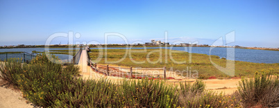 Bridge along the peaceful and tranquil marsh of Bolsa Chica wetl