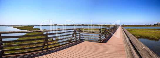 Bridge along the peaceful and tranquil marsh of Bolsa Chica wetl