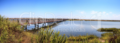 Bridge along the peaceful and tranquil marsh of Bolsa Chica wetl