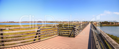 Bridge along the peaceful and tranquil marsh of Bolsa Chica wetl
