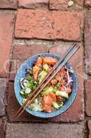 Raw salmon poke bowl with rice