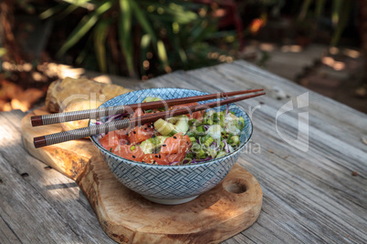 Raw salmon poke bowl with rice