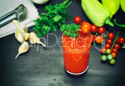 juice from a tomato and spices in a glass