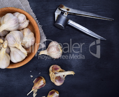 Fruits of garlic in a wooden bowl