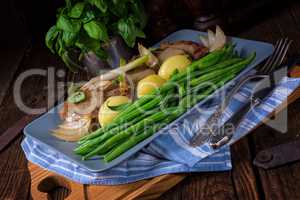 Beef medallions with caramelized beans and young potatoes