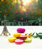Colored cakes macarons on a white table