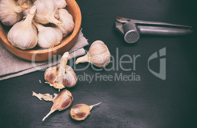 Fruit of garlic in a wooden bowl
