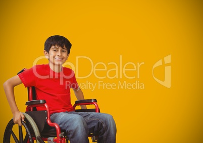 Disabled boy in wheelchair with yellow background