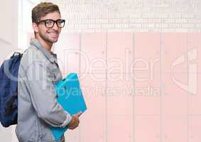 male student holding folder in front of lockers