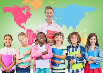 Kids holding school books with teacher in front of colorful world map