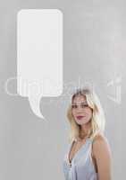 Woman with speech bubble standing against grey background