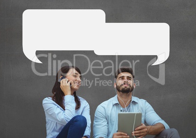 Business people with speech bubbles sitting against grey background