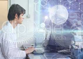 Male Student studying with computer and science education interface graphics overlay