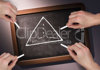 Hands drawing pyramid on blackboard