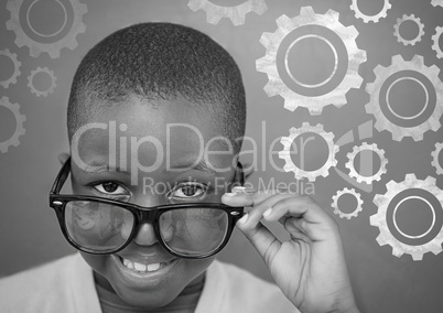 Settings gear cog icons on blackboard with boy